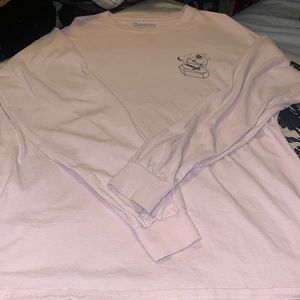 Long sleeve shirt. Pink. “Wish you were here,” written in the back of the shirt.